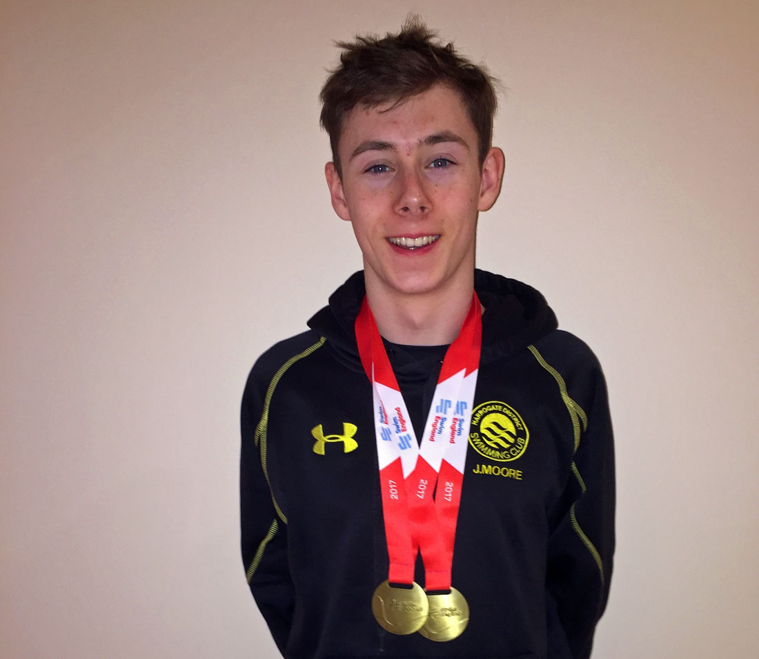 Swim King! Ashville College’s Joe Moore and his two gold medals