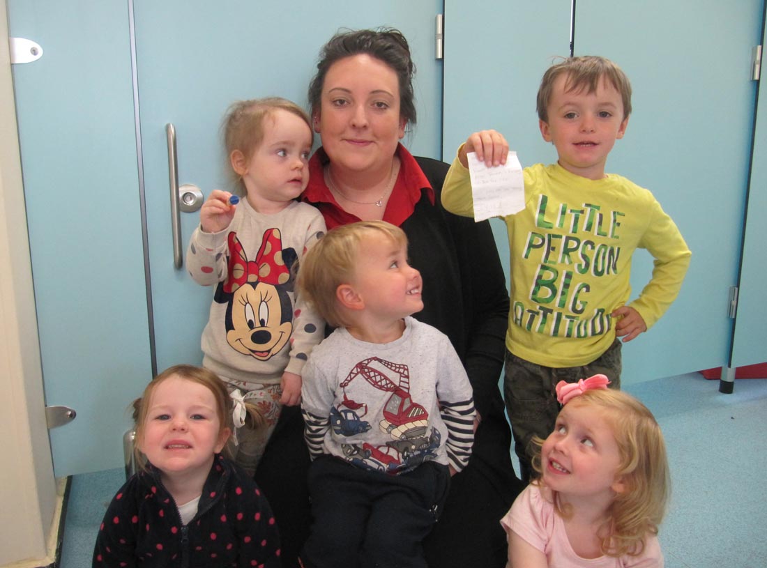 Some of the Tiny Teapots children with childcare practitioner Monique Towler on the site of the discovery