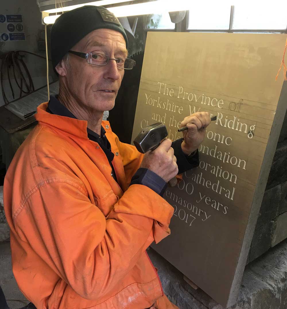 Stonemason Colin Rickard works on the ceremonial stone which is being laid in Ripon Cathedral’s North Transept