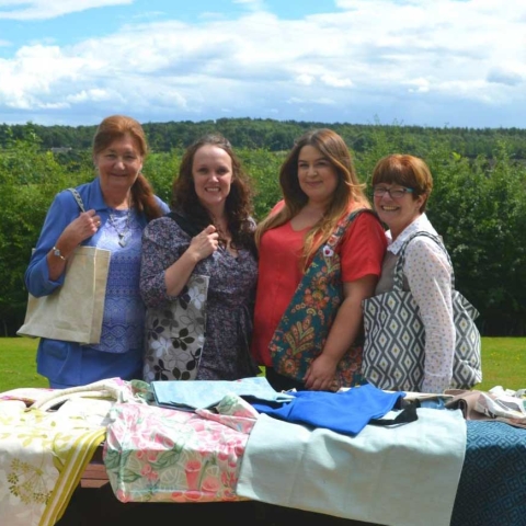 The Cone Exchange and Saint Michael’s team proudly showing off their bags. From left to right: Christine Smith, Cone Exchange Volunteer; Sarah Wells, Community Manager Bettys & Taylors Group; Alex Thomas, Healthcare Assistant Manager Saint Michael’s Hospice; Sue Snow, Cone Exchange Volunteer