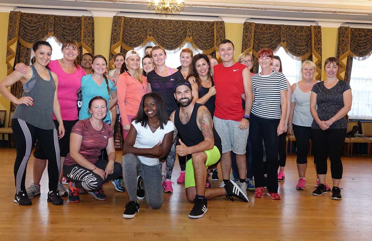 Charity Fundraisers! Zumbathon organier Fernando Samento De Alenca (front right) and fellow Zumba teacher Vania Goncalves (front left) with Zumba students, many of whom are participating in Saturday’s charity event