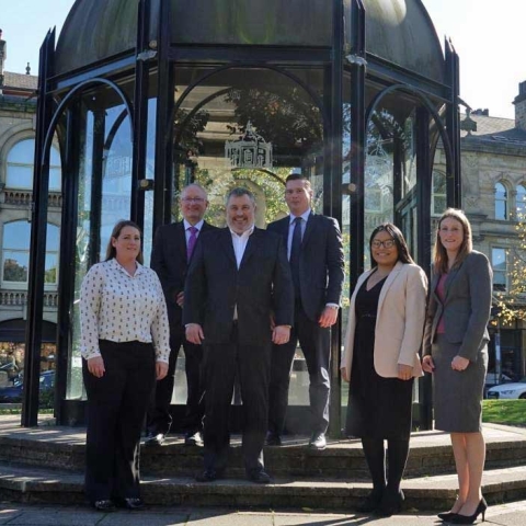 Expansion . . . Milners’ managing partner Simon Bass, centre, pictured with a Harrogate team strengthened by the appointment of conveyancing expert John Robson, second left