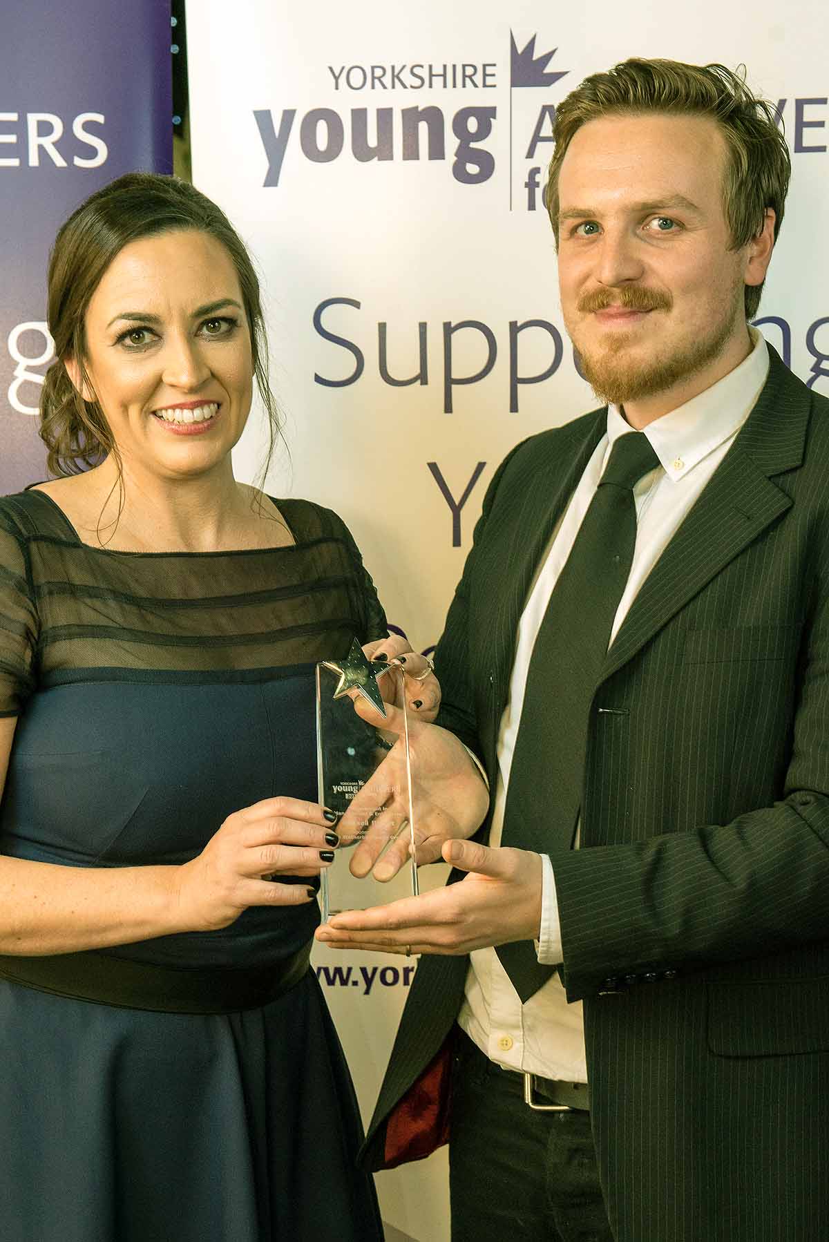 Achievement in Management and Enterprise winner Russell Bisset receives his award from Caroline Murphy of sponsors The Wetherby Whaler