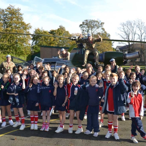 Pupils at Highfield Prep School and the Army Air Corps in front of the Gazelle Helicopter