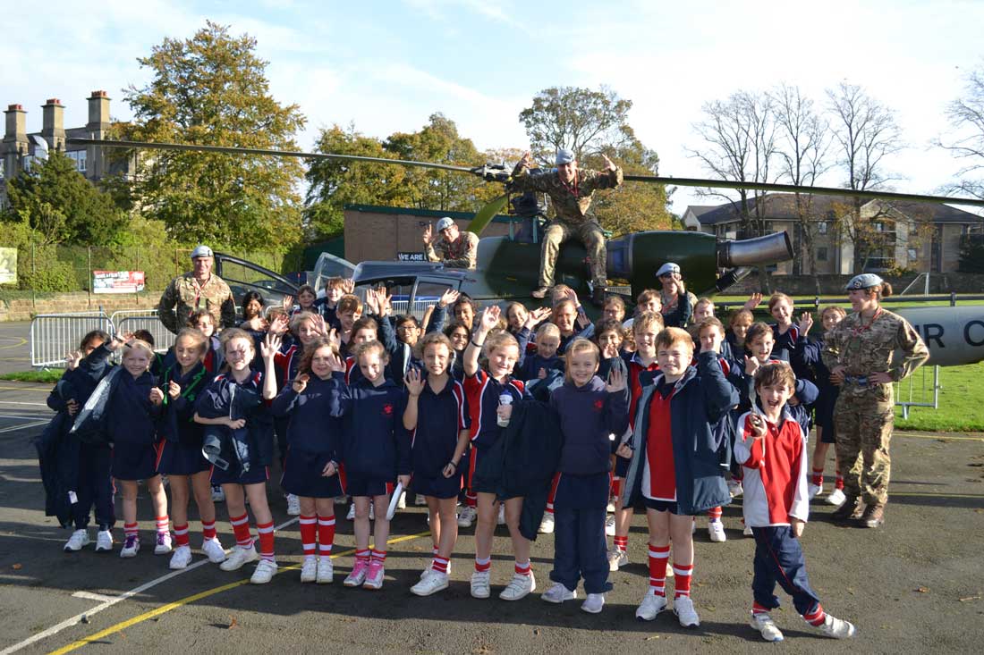 Pupils at Highfield Prep School and the Army Air Corps in front of the Gazelle Helicopter