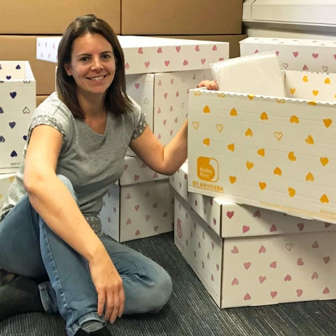 Toni Kitchen packing the baby boxes ready for transporting to Greece