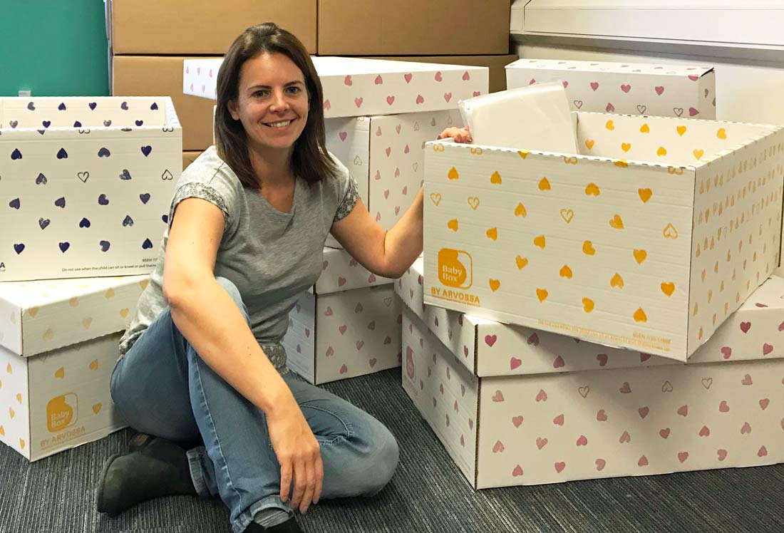 Toni Kitchen packing the baby boxes ready for transporting to Greece