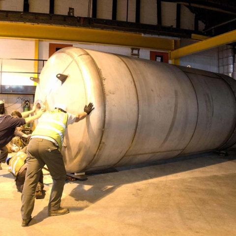 Liquid Investment! The Leeds-manufactured stainless steel multi-role vessel being positioned in place at T&R Theakston Ltd’s Masham brewery and then being installed