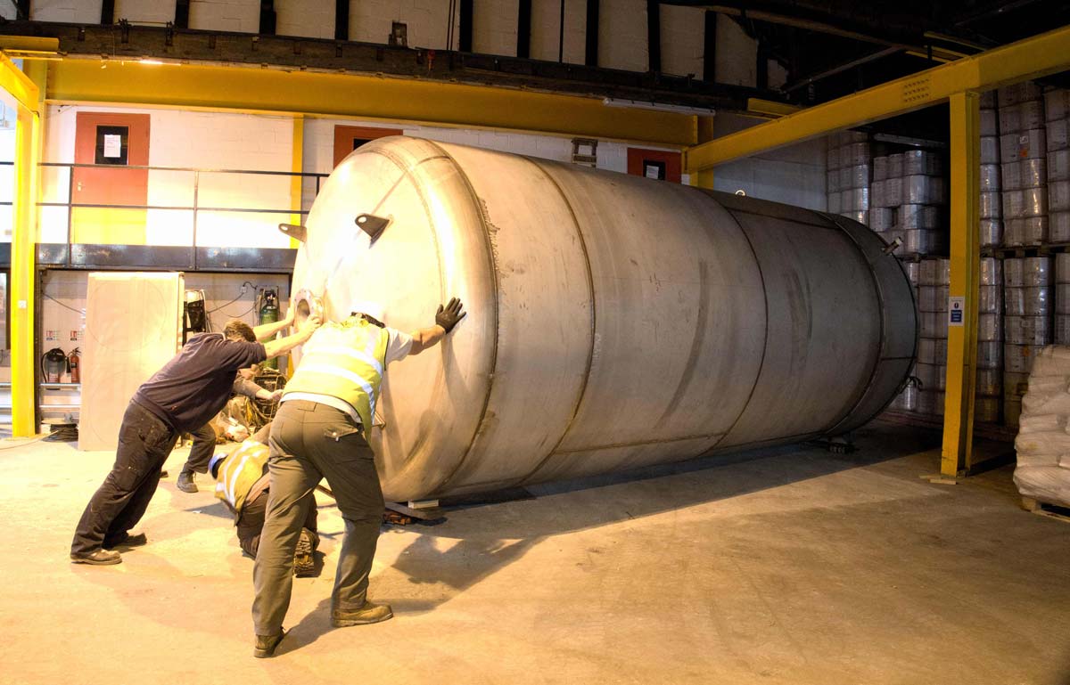 Liquid Investment! The Leeds-manufactured stainless steel multi-role vessel being positioned in place at T&R Theakston Ltd’s Masham brewery and then being installed