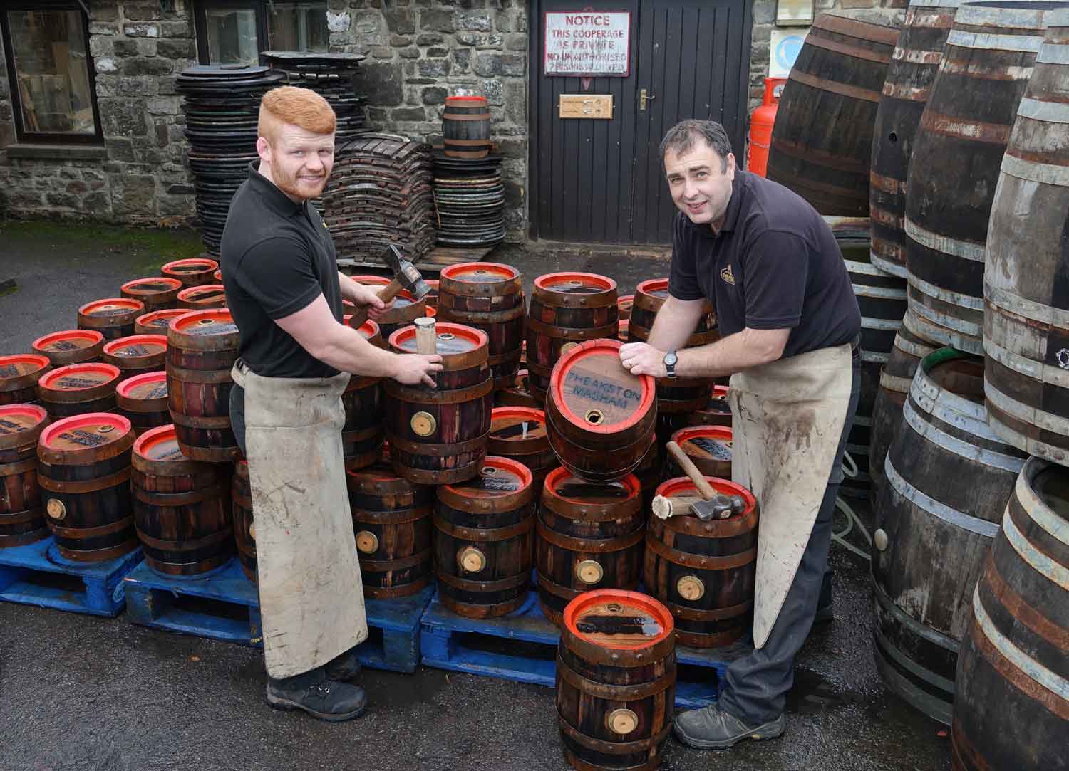 Christmas Crackers! Theakston’s coopers Jonathan Manby (right) and Euan Findlay with this year’s Christmas pins