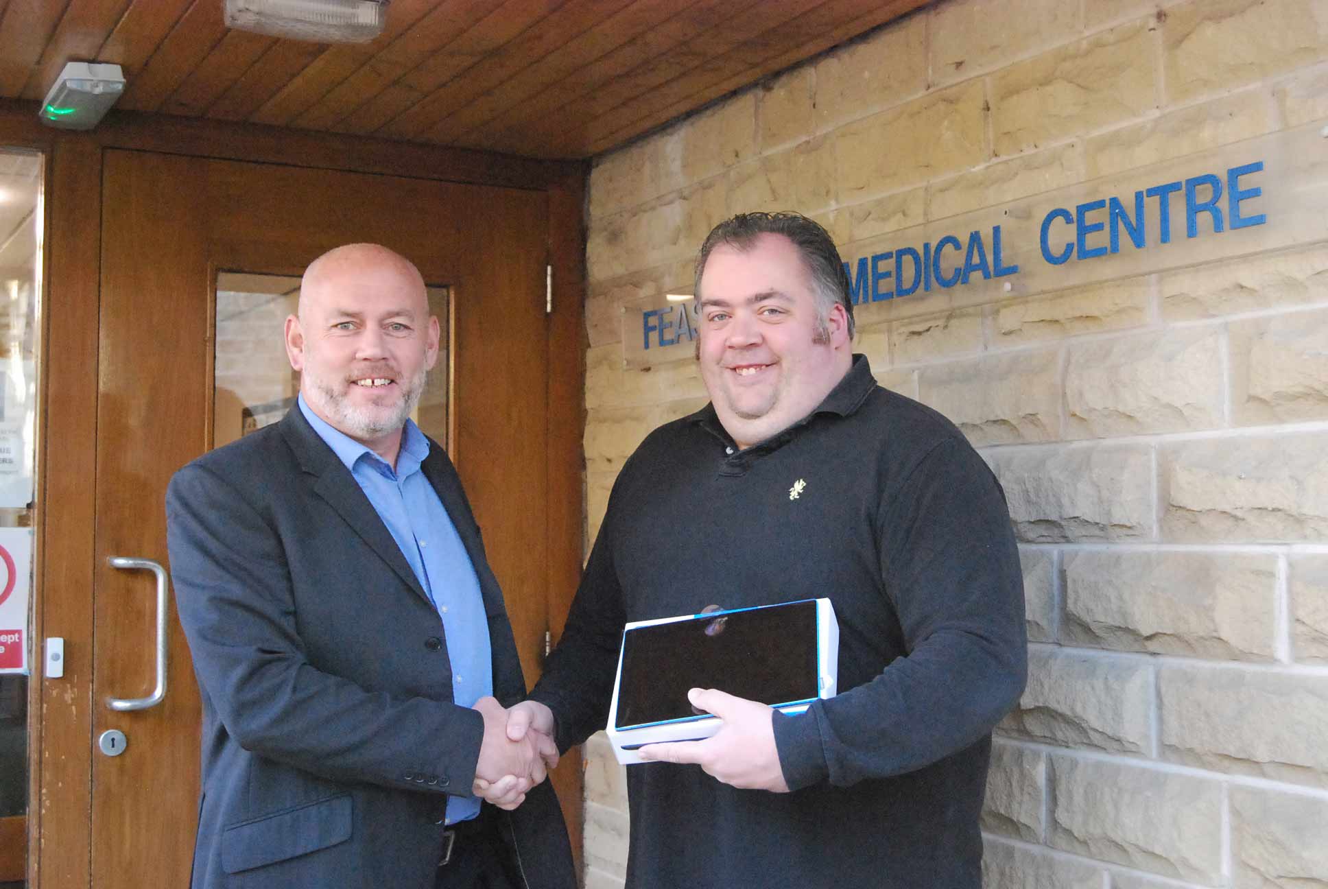 Pateley Bridge town councillor Antony Brown has received a tablet of a different kind in a prize draw run by a local consortium of doctors