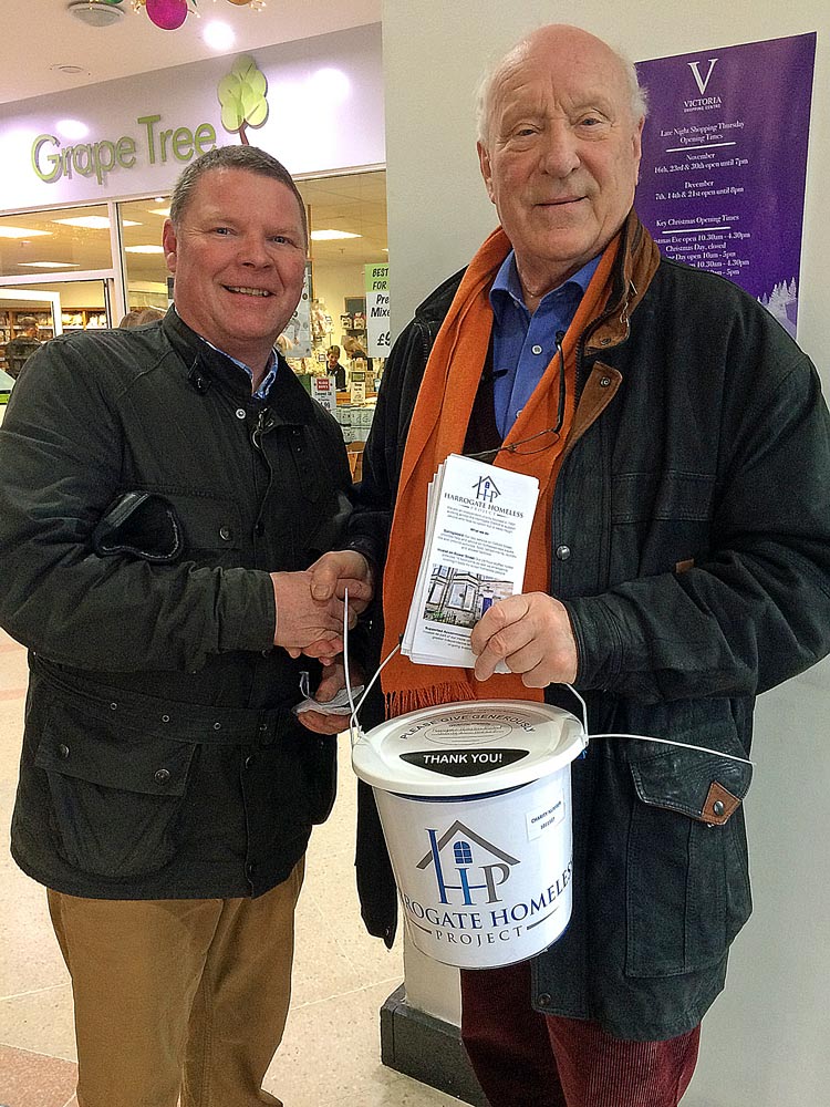 Chair of Trustees John Harris (right) with one of the volunteers at the Victoria Centre collection