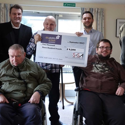 Wheely Good Effort! Picture are (back row) Disability Action Yorkshire Chief executive Jackie Snape, S+SA Architects Director Mark Fisher, Disability Action Yorkshire customer Andrew Varley and Joel Smith and Jon Brookman, both from S+SA Architects, and (front row) Disability Action Yorkshire customers Wayne Martin and Darren Askwith