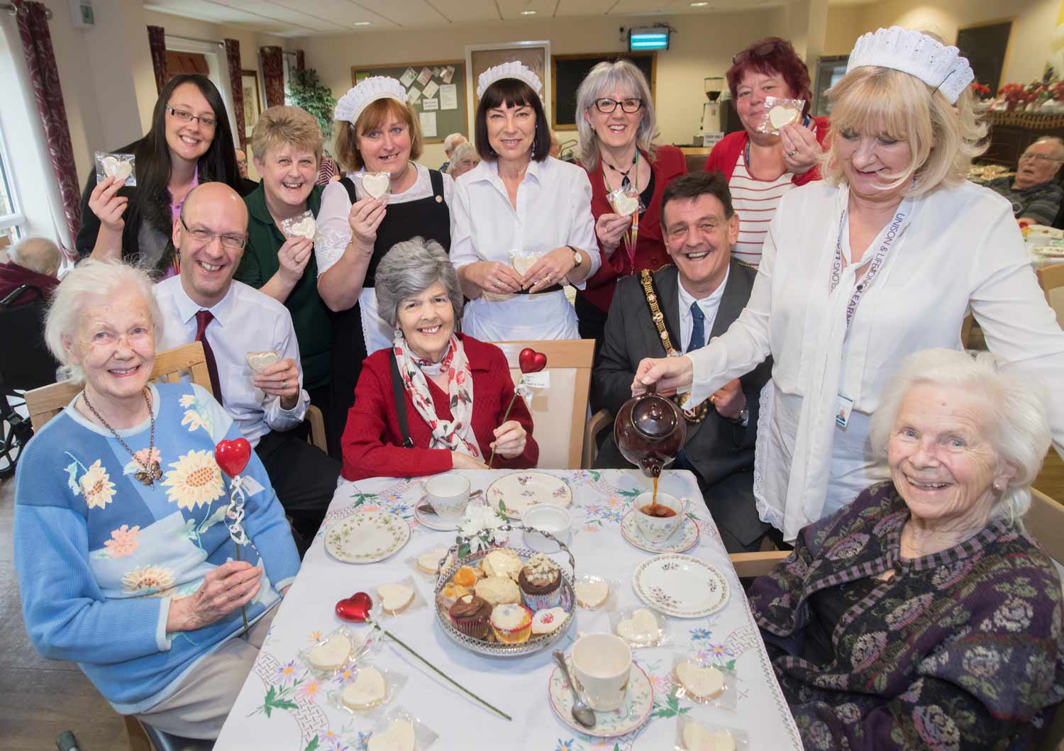 Care staff, family members and residents celebrate Dignity Day with County Councillor Caroline Dickinson, Executive Member for Public Health (back row second from right); Richard Webb, North Yorkshire’s director for adult social care and health integration (front row second from left) and Cllr Stuart Parsons, Mayor of Richmond