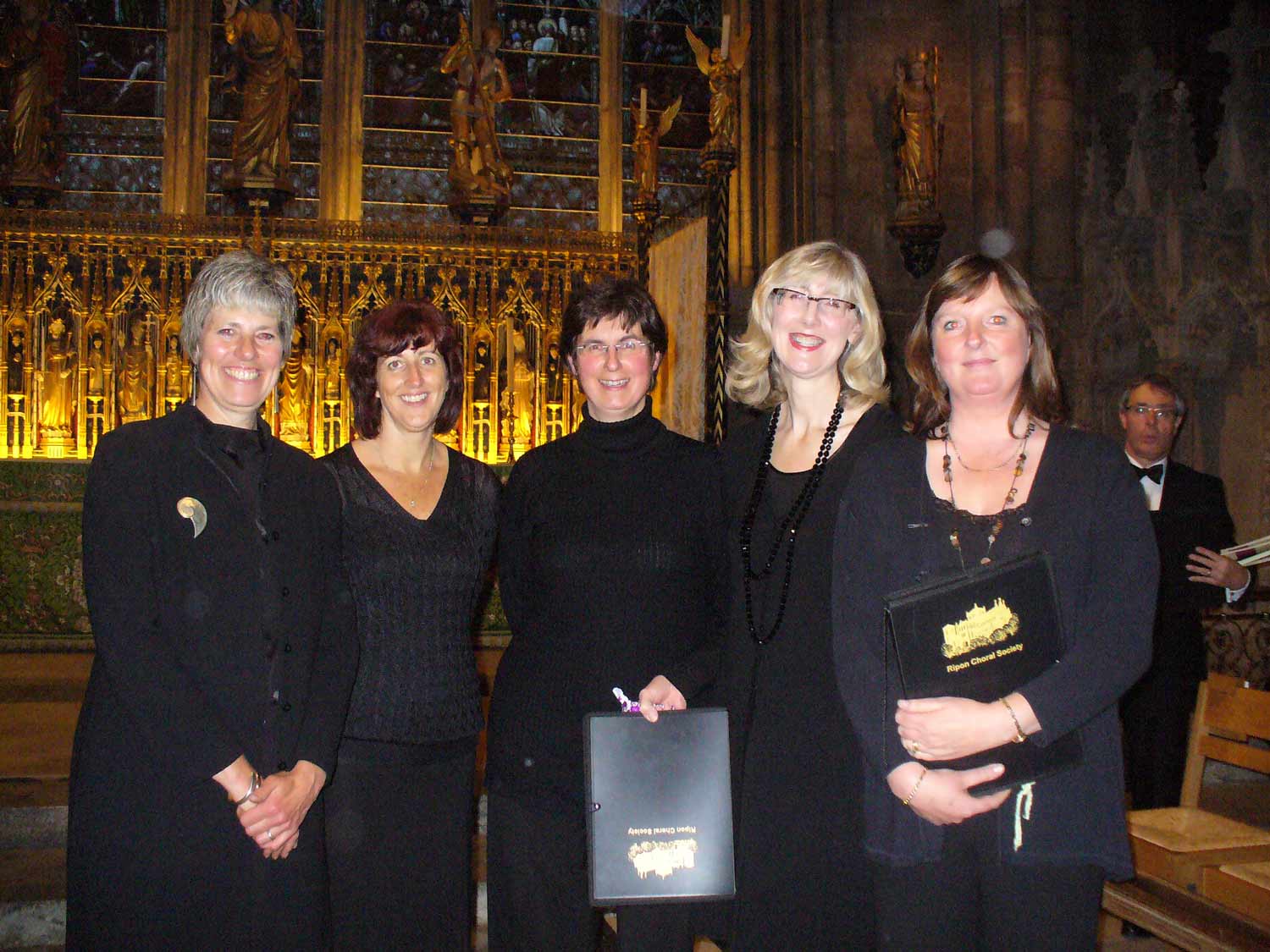 Bridget Taylor-Connor (far left) has organised a Come and Sing Messiah at St John’s Church, Sharow. The event will raise money for Yorkshire Cancer Research in memory of Bridget’s friend, Sally Robinson (far right), who passed away from cancer in 2013