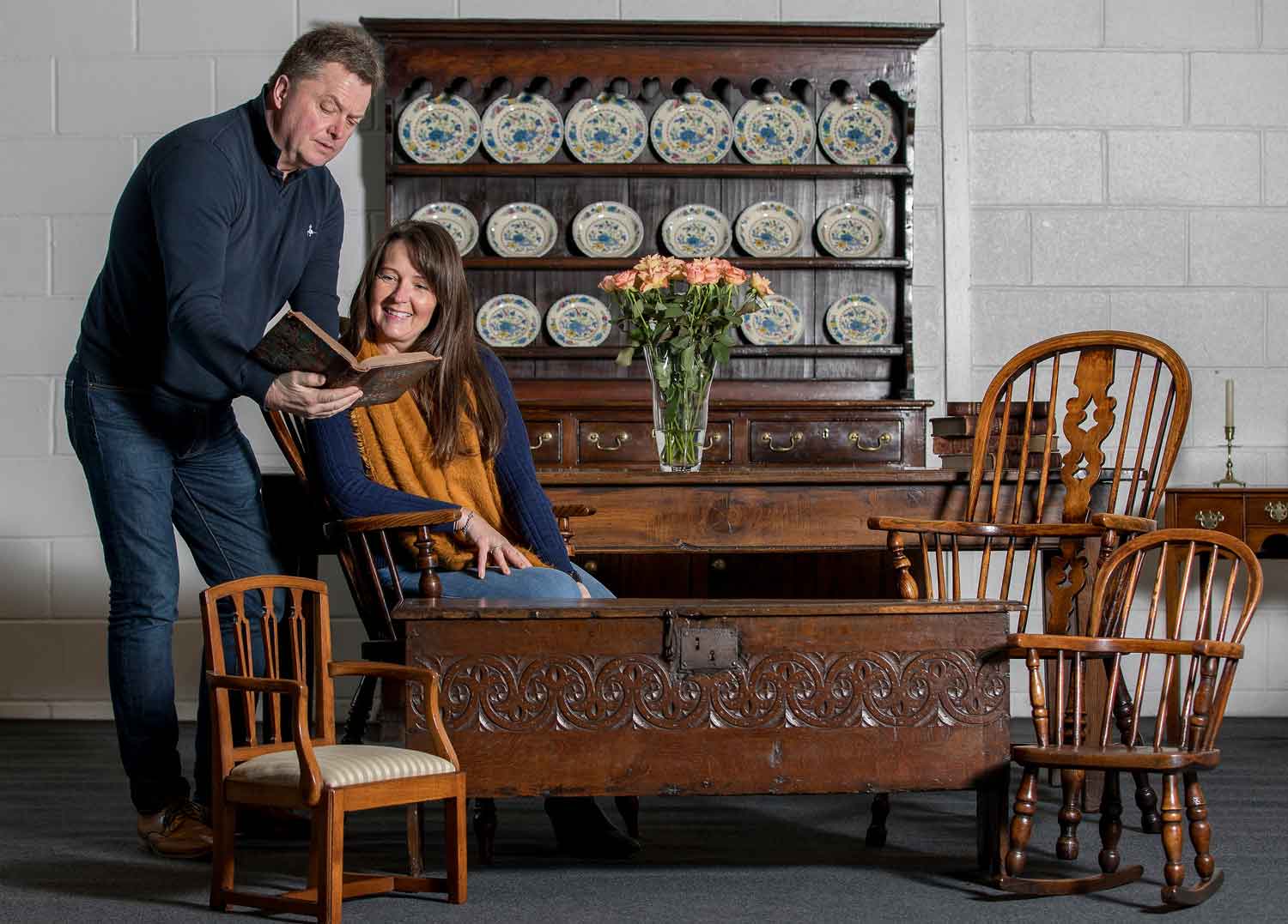 Sam Wigston and Nick Bayliss of Continuity Fairs with furniture including an oak sword chest from the 1600s and Carmarthen oak dresser