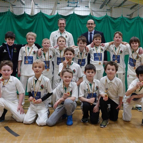 ndoor League Champions! Stowe Family Law CEO Charles Hartwell, back right, and Harrogate U9’s coach Brian Summerson, back left, with the victorious U9’s team sporting their medals
