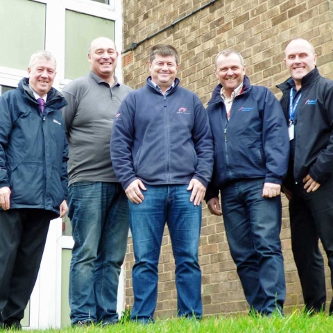 (L-R) Councillor Mike Chambers with maintenance contractors Alistair Symonds (Walter Hartley Ltd), Steven Hepworth (Norton Interiors Ltd), and John Ebbs and Kevin O’Donovan (Help-link UK Ltd), outside the flats on Ripon’s Allhallowgate