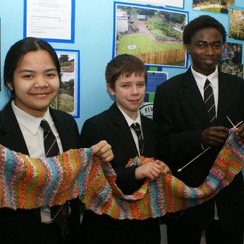Some of the young knitters at Rossett School with the scarf they have made to donate to a homeless person