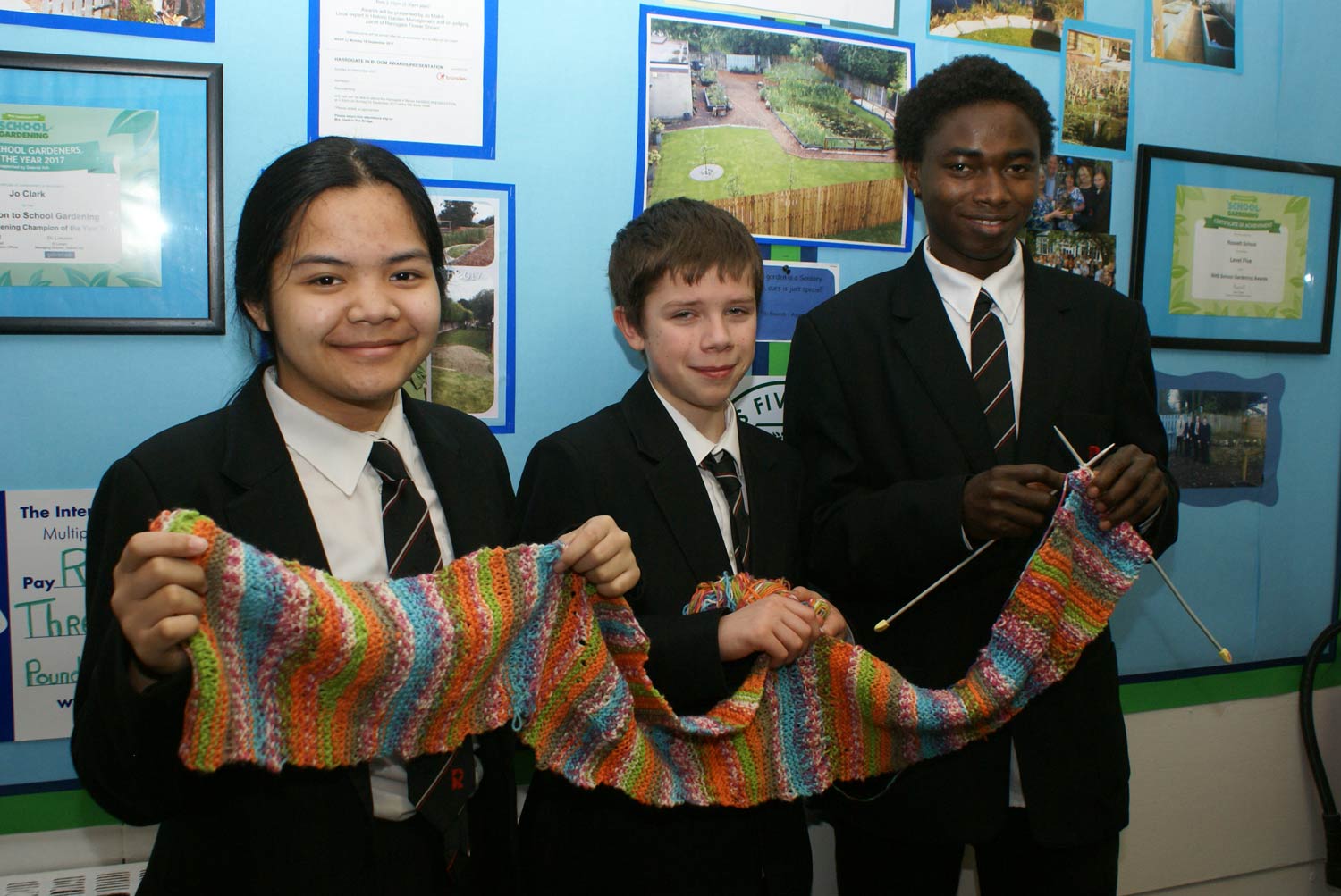 Some of the young knitters at Rossett School with the scarf they have made to donate to a homeless person