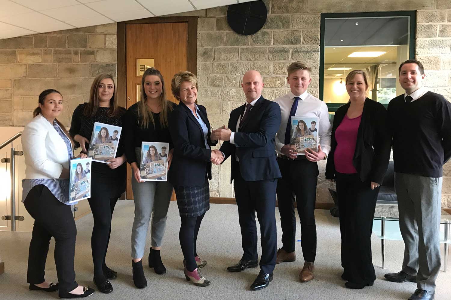 Just the job...Paula Ingham and the Linley & Simpson team of apprentices collect the gold award from Tony Marshall, of the Profound Group