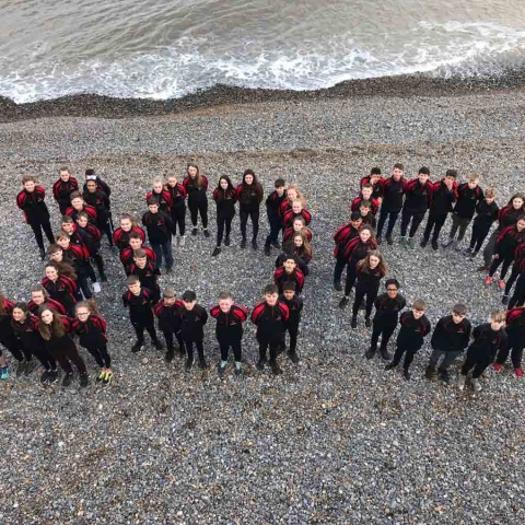 Rossett students celebrate the school's recognition in the top 100 state schools for sport during their Sports Tour