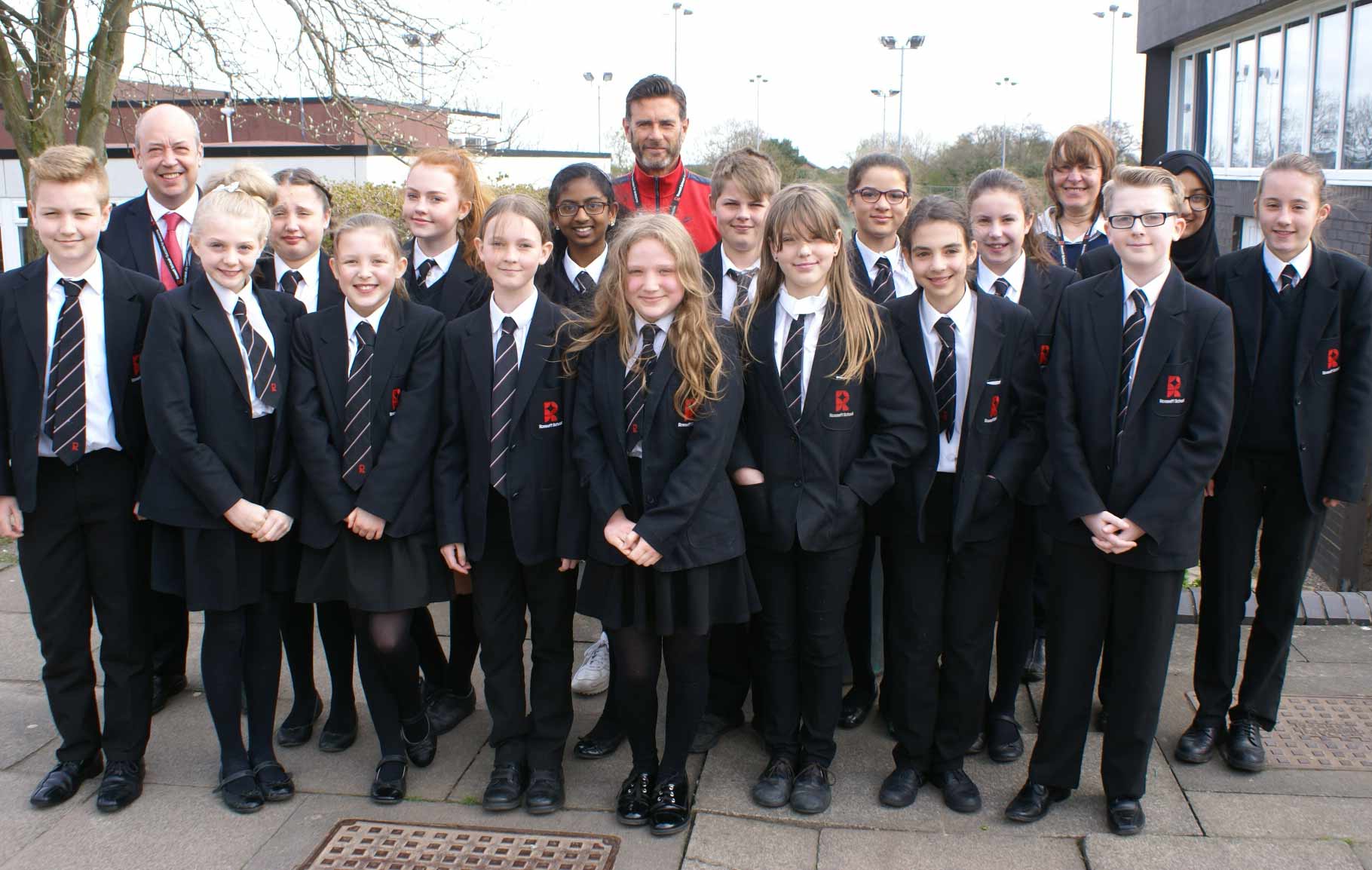 Year 7 students celebrate academic progress with Director of Learning Mike Sweetman (centre), Student Support Officer Debbie Banyard (right) and Head of Pastoral Care Dave Royles