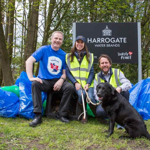 Richard McIlwain, left with, James and Nicky Cain of Harrogate Water and their labrador Bella