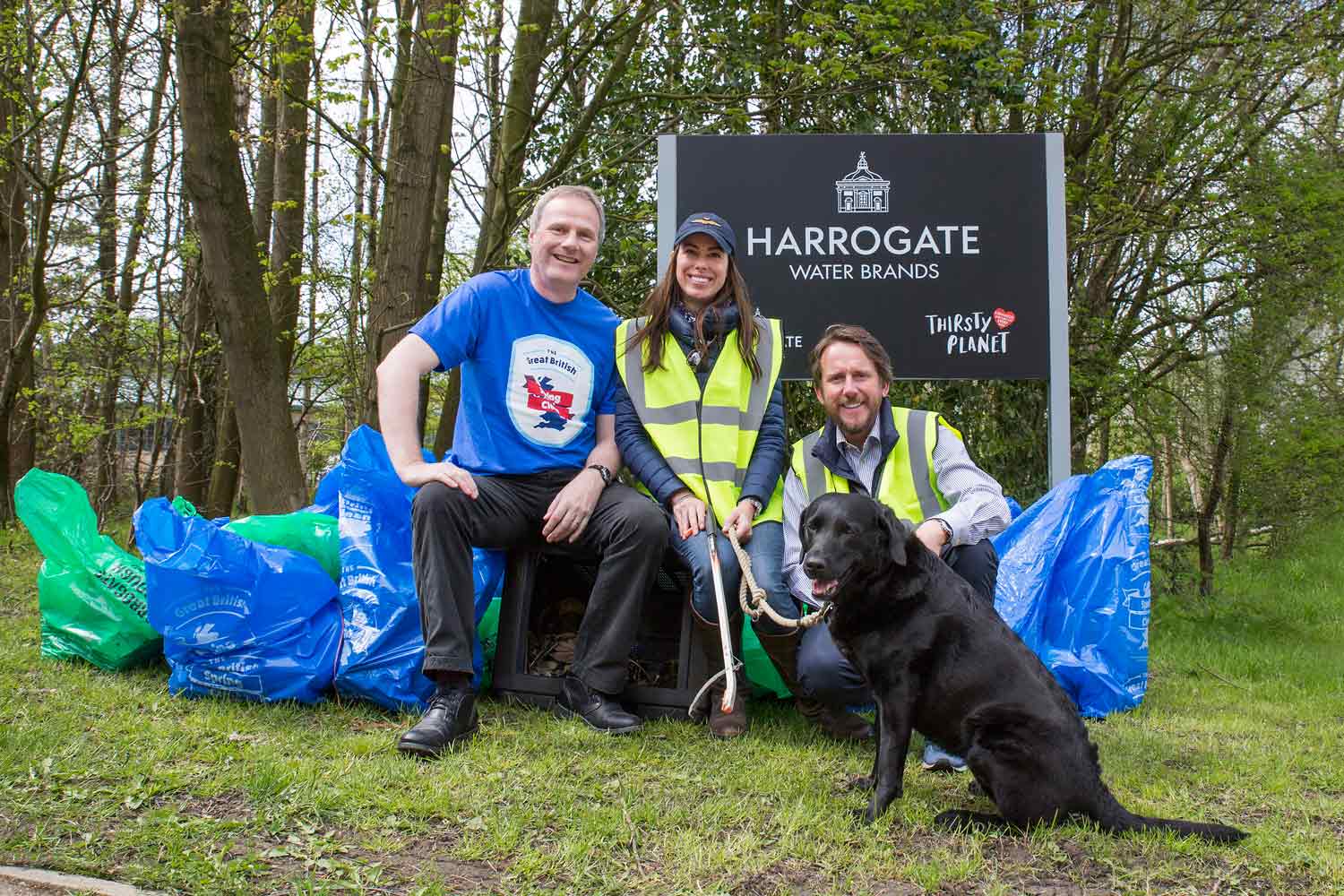 Richard McIlwain, left with, James and Nicky Cain of Harrogate Water and their labrador Bella