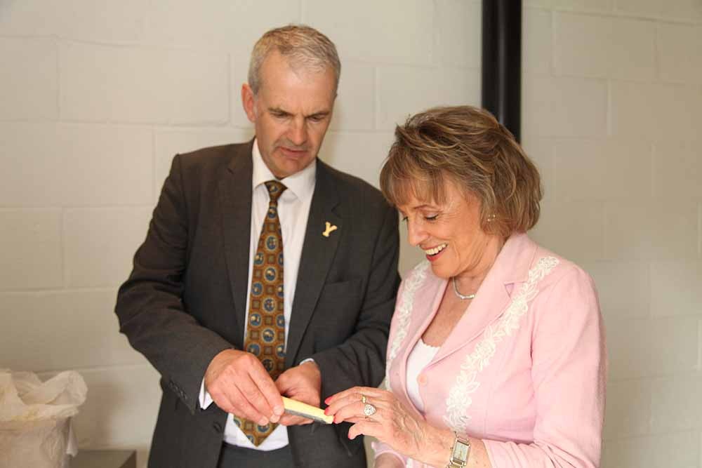 Dame Esther Rantzen and David Hartley Managing Director for Wensleydale Creamery cheese tasting in the bothy in the Welcome to Yorkshire garden at Chelsea Flower Show 2018, designed by Mark Gregory for Landformconsultants.co.uk