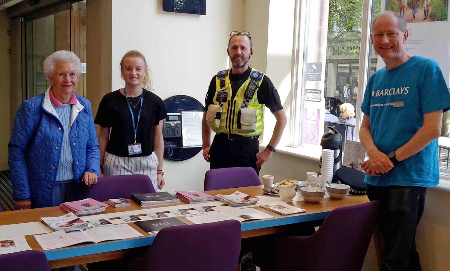 Police Community Support Officer Julian Ward of York's Safer Neighbourhood Team and Ella Jessop of North Yorkshire Police's Economic Crime Unit join forces with staff at Barclays Bank to provide customers with fraud prevention advice