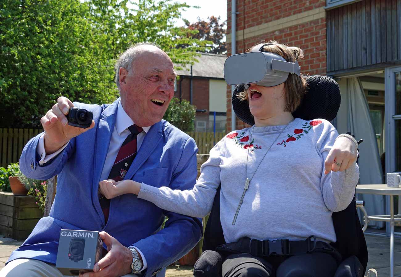 Looking Good! The Spa Lodge Charity Steward Doug Mills watches Disability Action Yorkshire customer Kayleigh Atkinson experiencing the new virtual reality headset, funded by the Freemasons