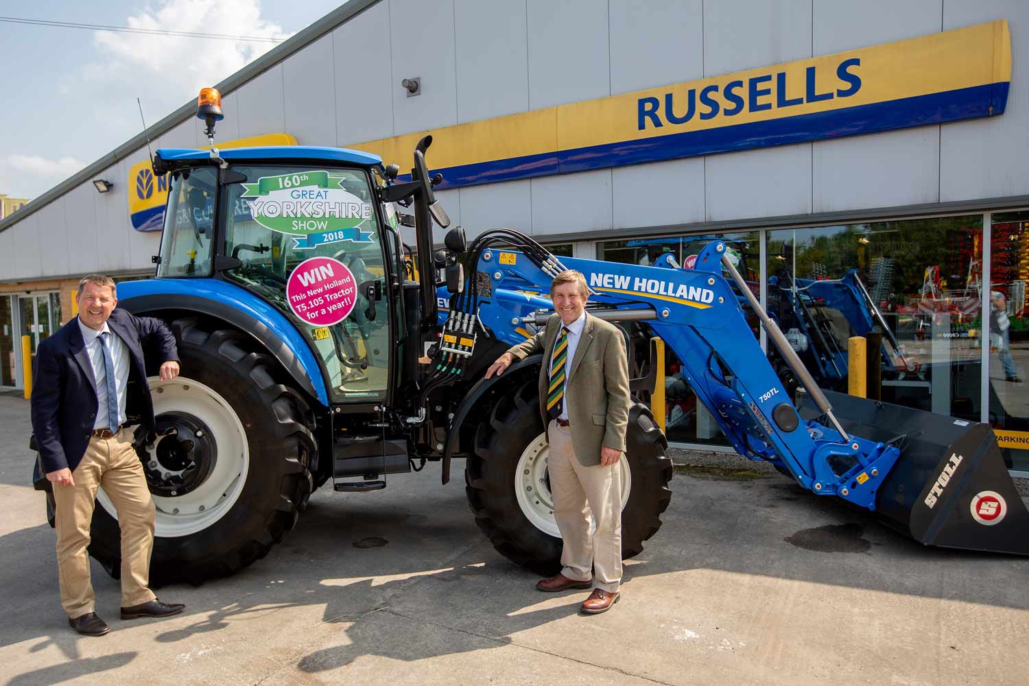 Russell Group Chief Executive Paul Russell, left, and Show Director Charles Mills with the tractor that can be won for a year at the Great Yorkshire Show