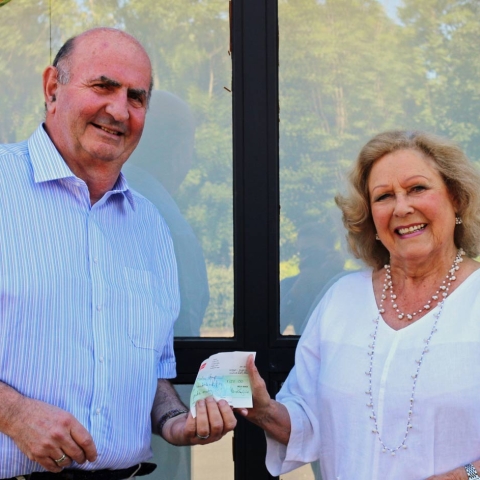L-R Avalon CEO Larry Hollando receives a cheque from Bridge Bunch member Susan Nobbs