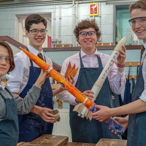 One Small Step…..Ashville Rocket Club members Zoe Moseng, Diego Roth, George Hayfield and Wesley Smith work on their rockets