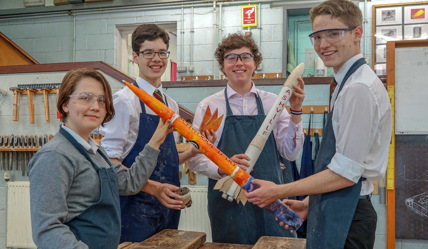 One Small Step…..Ashville Rocket Club members Zoe Moseng, Diego Roth, George Hayfield and Wesley Smith work on their rockets