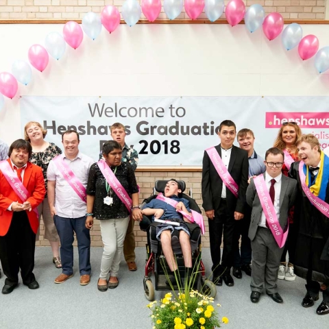 The class of 2018 celebrating their graduation with, far right, speaker Jono Lancaster