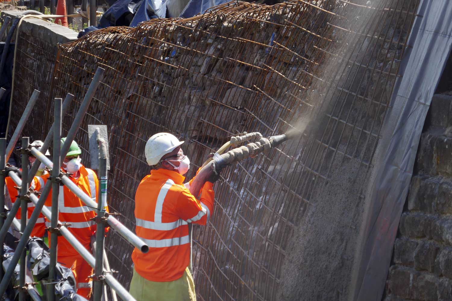 Contractors shotcreting the wall below the A59 at Kex Gill earlier this week