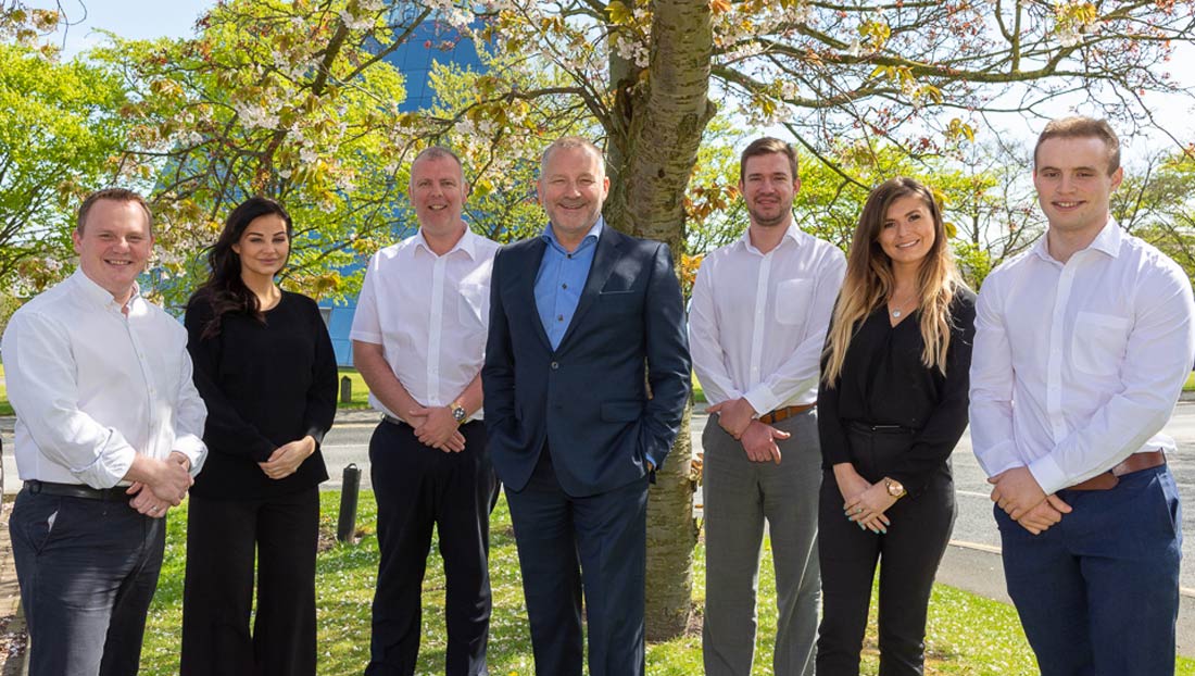 Most successful year to date: Paul Parkinson (centre) with new team members.