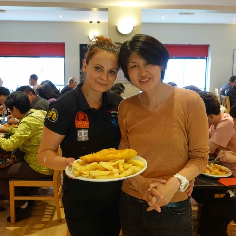 Caption: Fish and chips times 21! Scotts Fish and Chips manager Roxana Vasai (right) and Chinese tour group leader, Linda Lin in front of her tour group