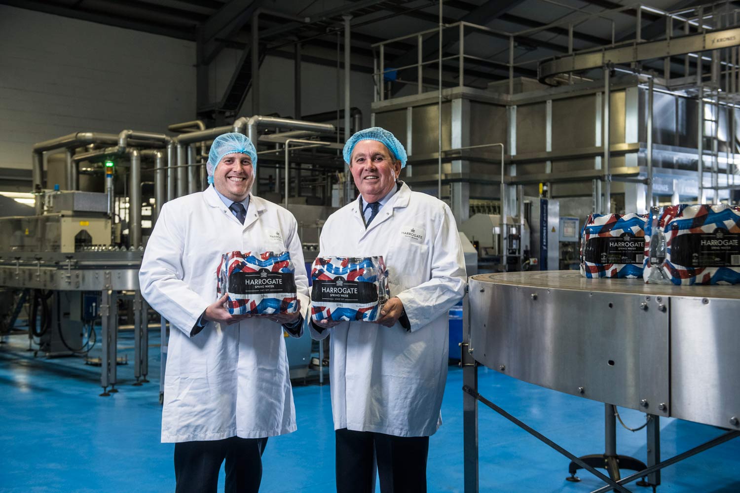 Pictured (L to R) are Harrogate Water Brands export and new business development manager, Greg Hatton, and Chamber International logistics adviser, Robin Finnis, in the production hall at Harrogate Water Brands
