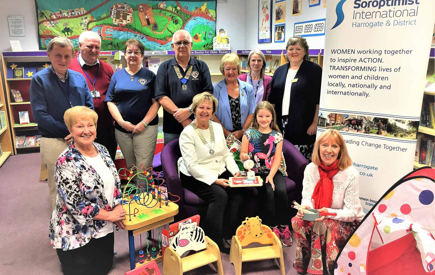 The photograph also shows Soroptimist International Harrogate & District’s President’s Hilary Waddington and Elsie Johnston, members Sue Williams, Pat Shore & Sandra Jowett. Together with Knaresborough Lions President Bob Godsell and his wife Pamela and library staff member Maria Burley and volunteers Ged Williams and Keith Harmer.