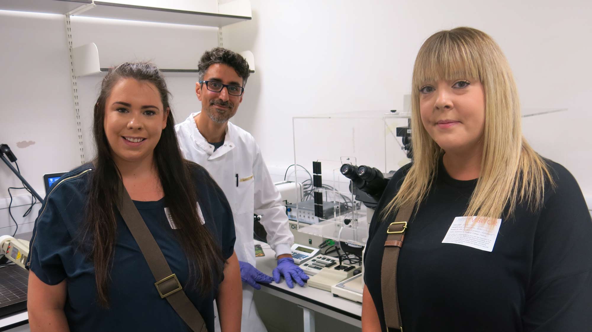 Melissa and Rebecca Foulis with scientist Nabil in the lab