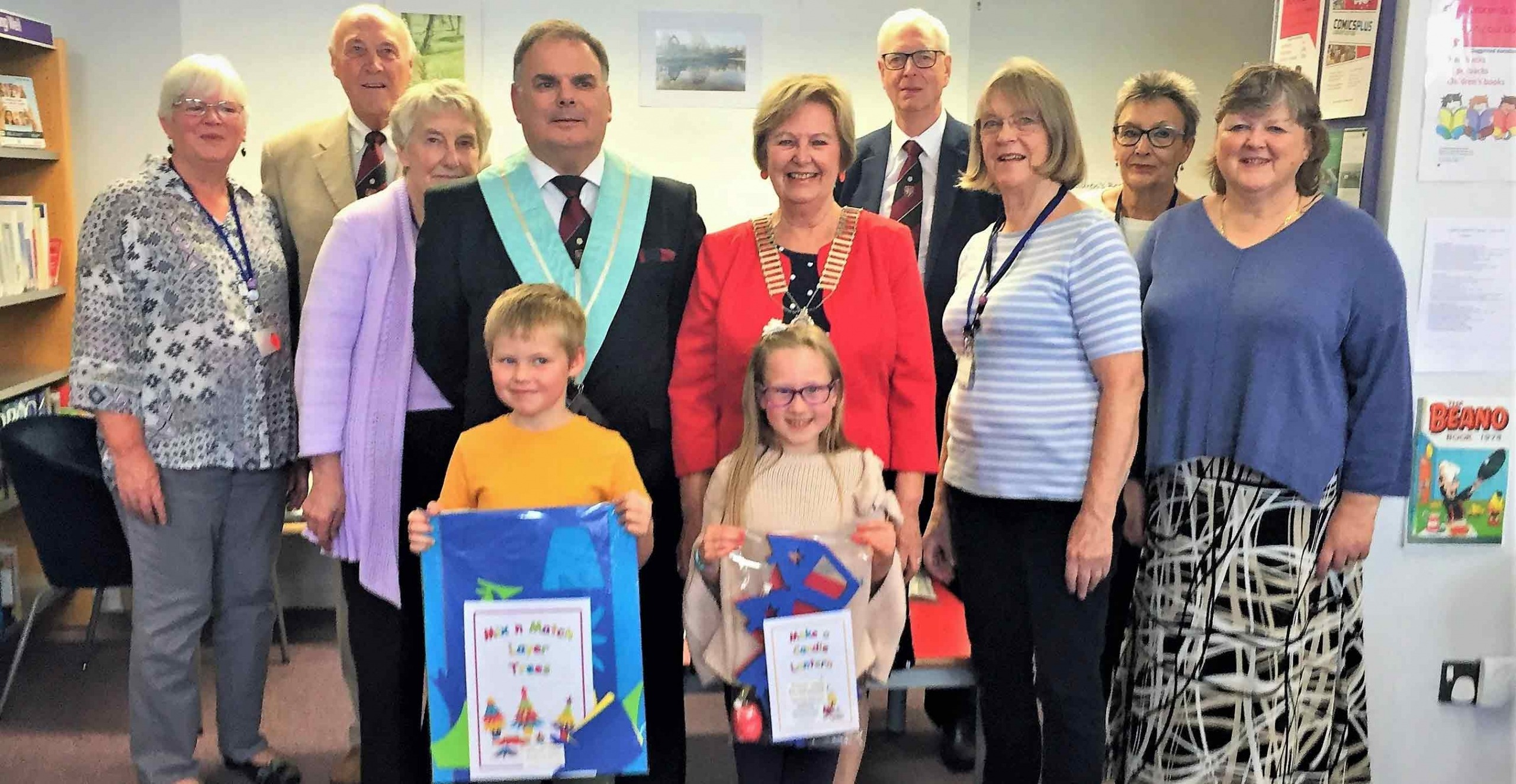 homas Henry and Amelia Williams at the front with Soroptimist International of Harrogate and District's President Hilary Waddington and member Sue Williams together with Stephen Brown Master and Spa Lodge members Doug Mills and John Shore together with Chairman of Starbeck Community Library Julia Mosley and fellow Trustees and volunteers Anne Henry, Margaret Manning and Tina Gilchrist