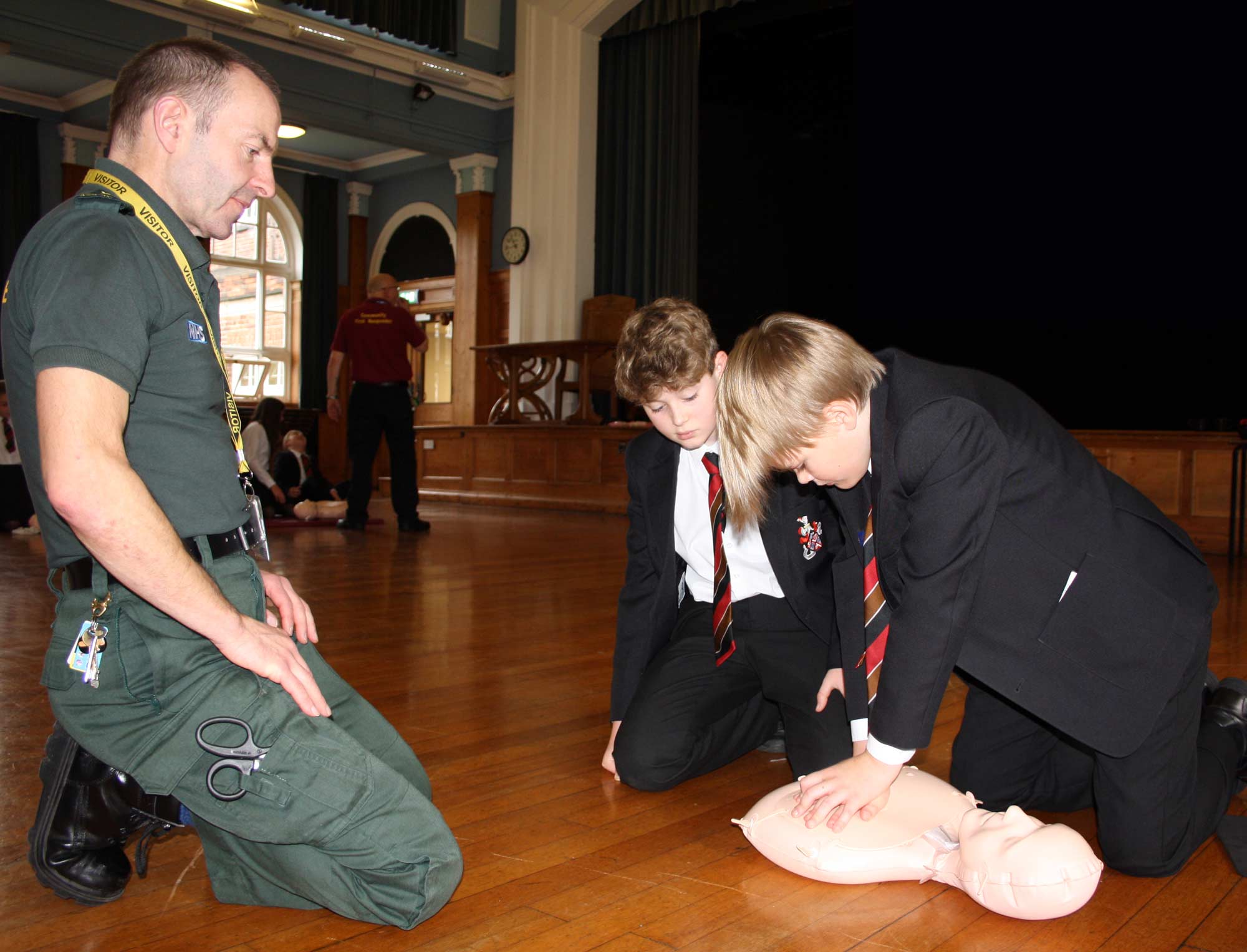 Nicholas Andralojc from Yorkshire Ambulance Service NHS Trust with two Year 7 students Ollie Poyser-Senior and Toby Wilkins