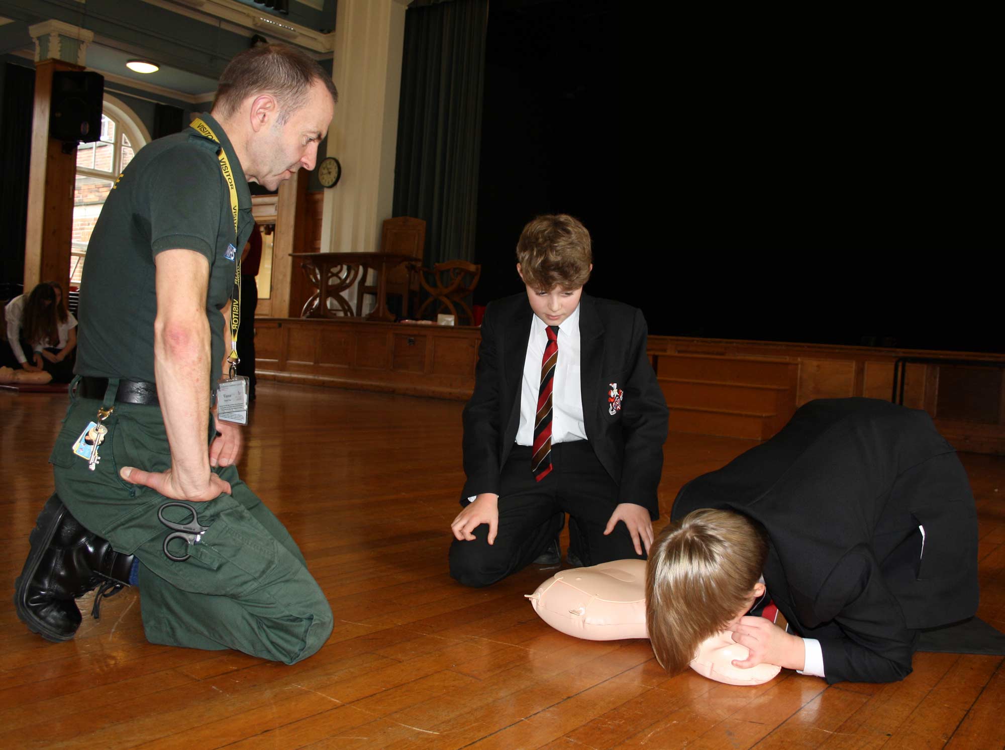 Nicholas Andralojc from Yorkshire Ambulance Service NHS Trust with two Year 7 students Ollie Poyser-Senior and Toby Wilkins