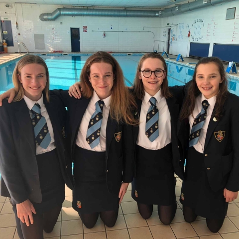 Imogen, Georgi, Evie and Agatha in front of the Ripon Grammar School pool