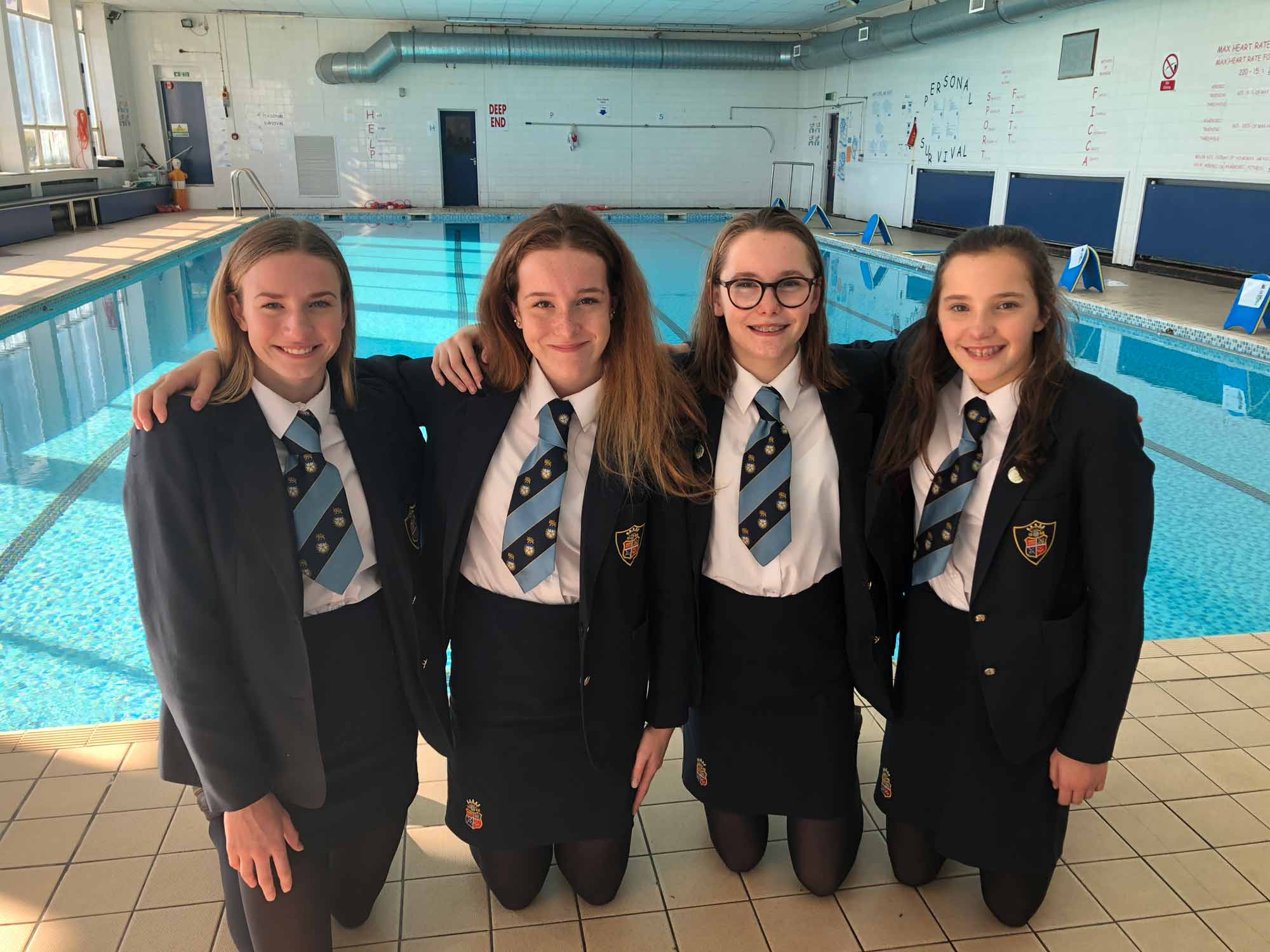 Imogen, Georgi, Evie and Agatha in front of the Ripon Grammar School pool