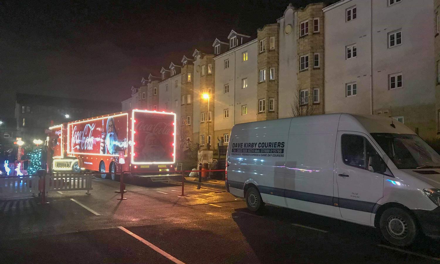 Christmas has come early! The Coca-Cola Christmas Truck next to a Dave Kirby Courier’s van