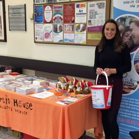 X-mas factor ... Emily Wilkinson staffs the Martin House charity Christmas card stall